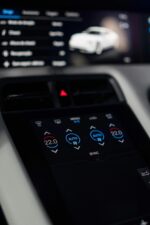 Close-up of a sleek car dashboard featuring a digital control interface.
